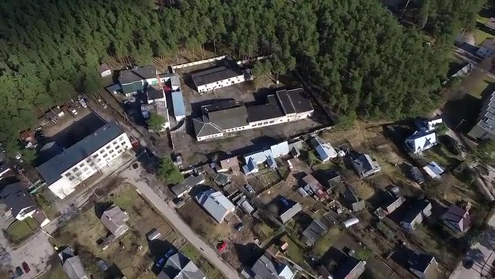 Flight Over Buildings Near Forest 3