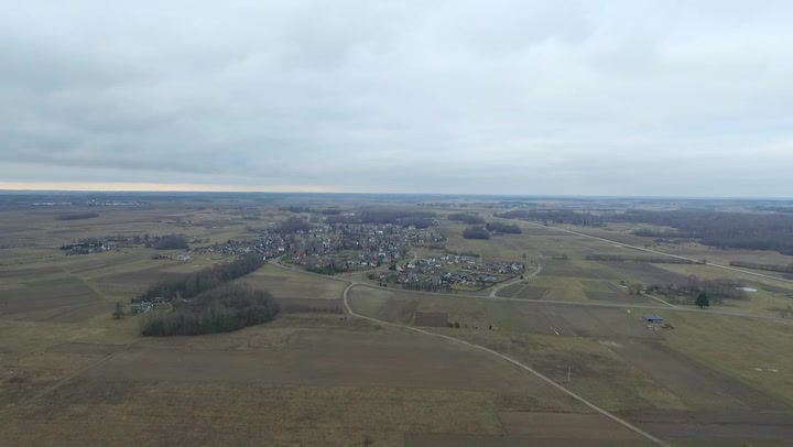 Flight Upwards Over Small Town In Distance