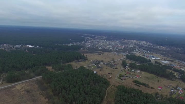 Flight Over The Forest And Small Town In Distance 2