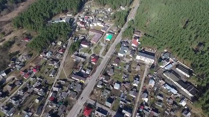 Flight Over Small Town Near Forest 1