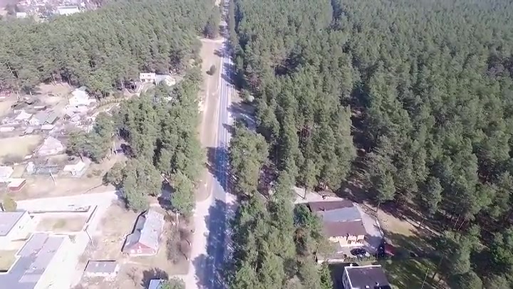 Flight Over Small Town Near Forest 2