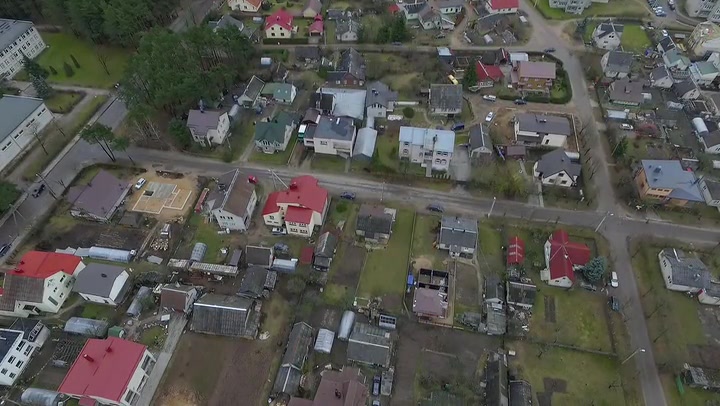 Flight Upwards Over Small Town Near Forest