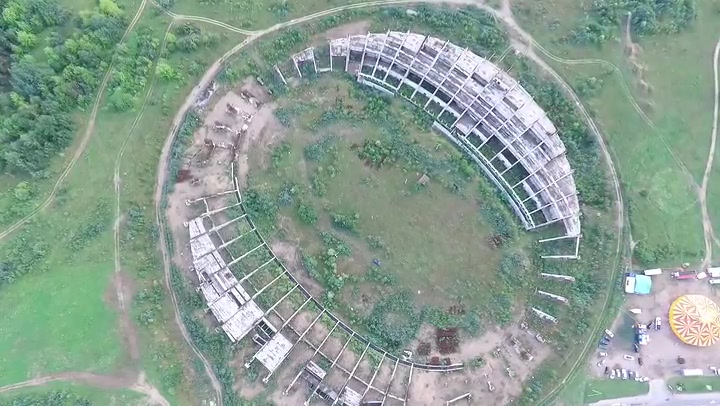 Slow Vertical Landing Over Abandoned Stadium