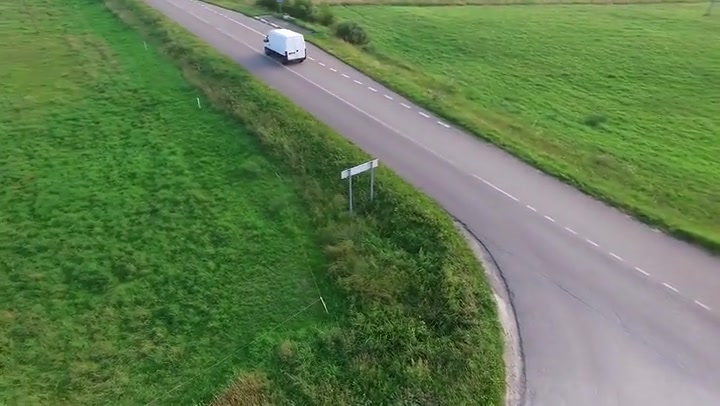 Country Road From Above With Passing Cars