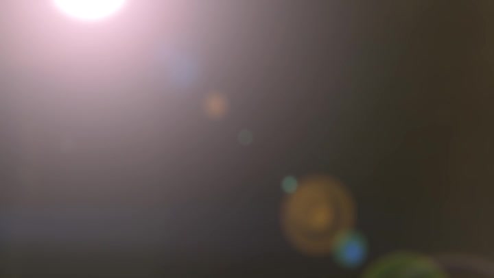 Blurred Dust Particles With The Light Source And Lens Flares